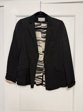 Classic Black Women's Blazer with Patterned Lining and Slight Shine on Exterior